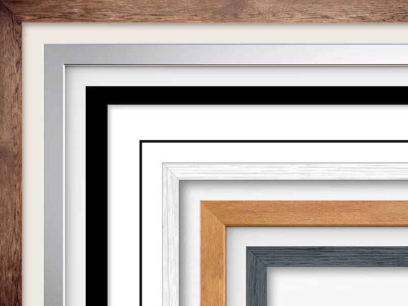 Several different frame mouldings showing the range, including black, white and natural wood.