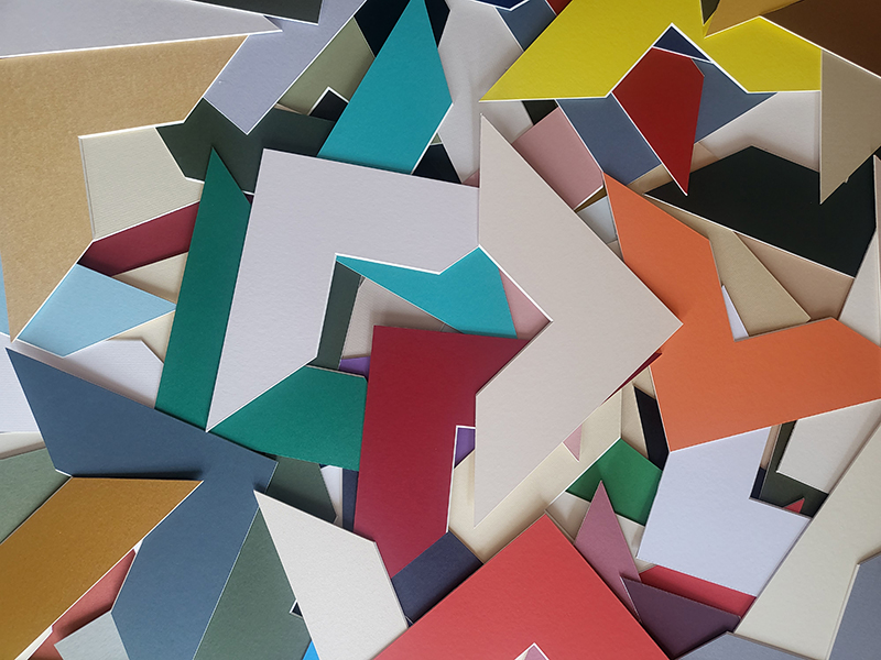 Matboard colour samples in a jumble illustrating the different colours available